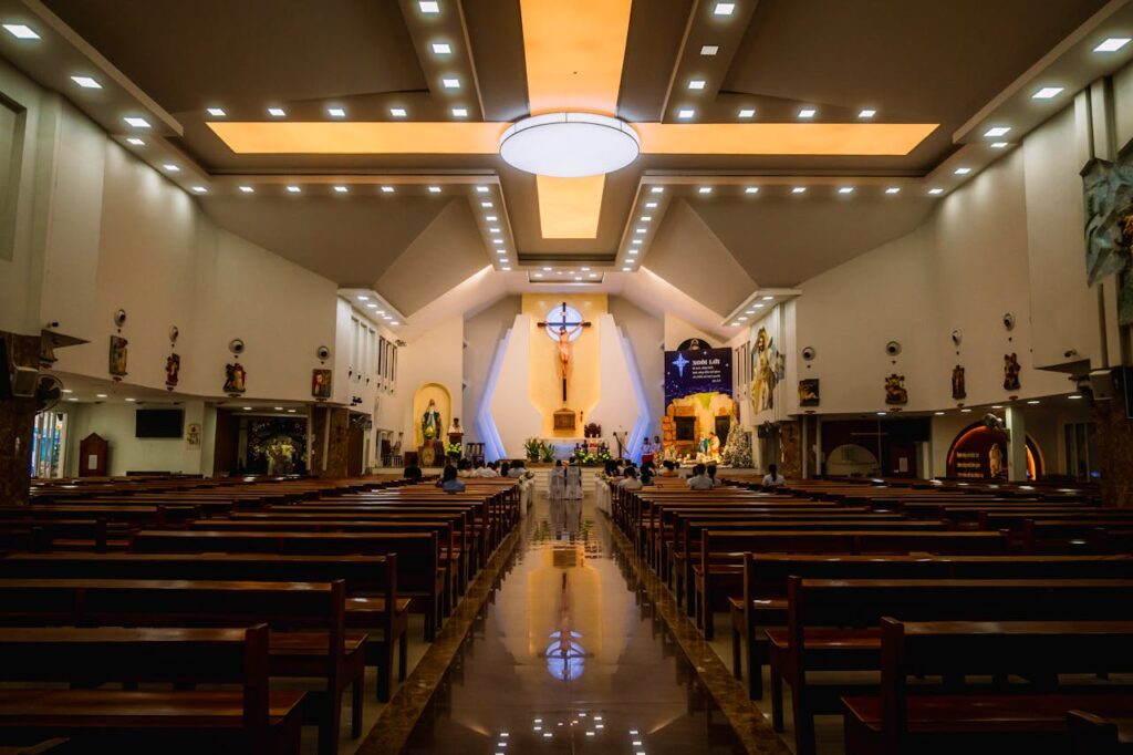 Elegant church interior in Ho Chi Minh City with ornate altar and seating.